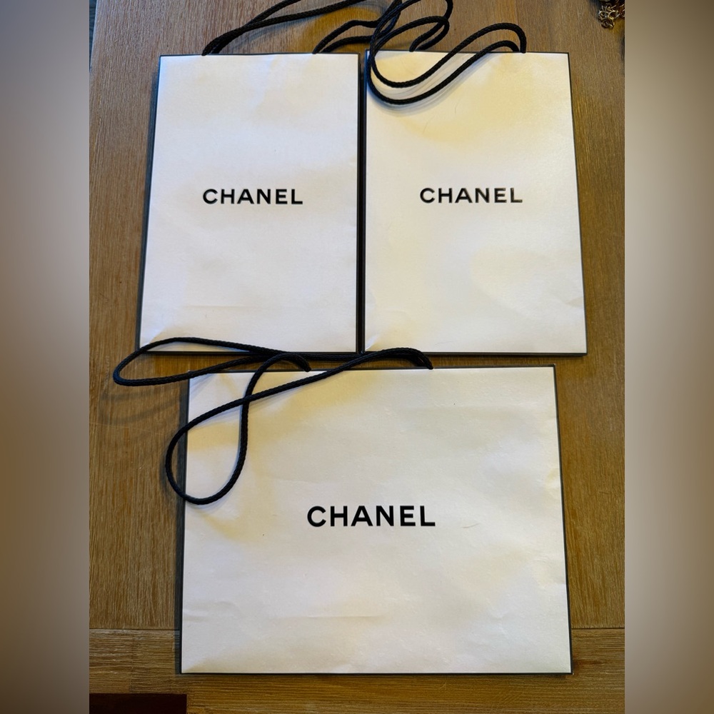 CHANEL Elegant White Gift Bags with Black Accents